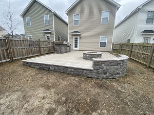 Hardscape with fire pit and outdoor kitchen